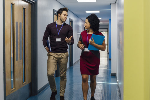 Two office workers solving a problem